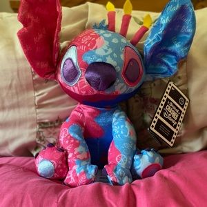 Stitches crashes Disney Sleeping Beauty plush.
